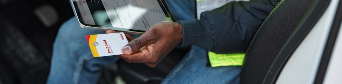 Man with shell card in hand