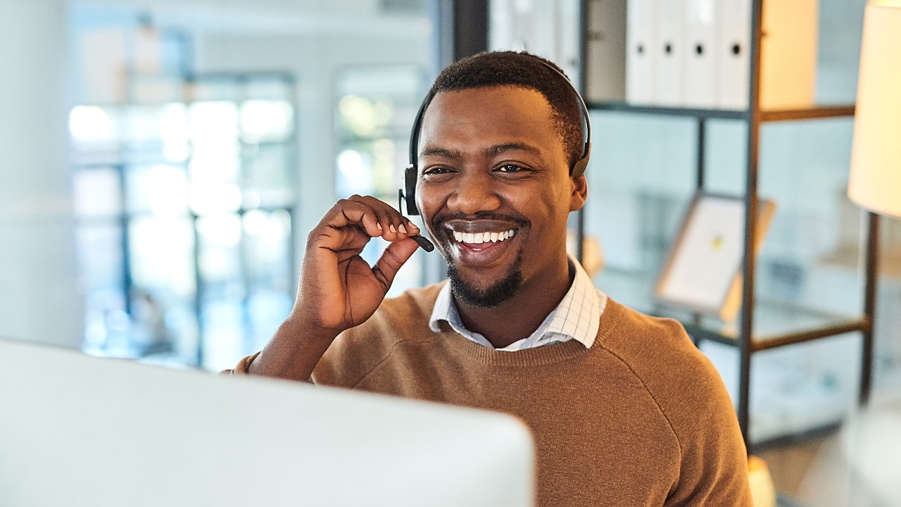 A person wearing a headset at an office