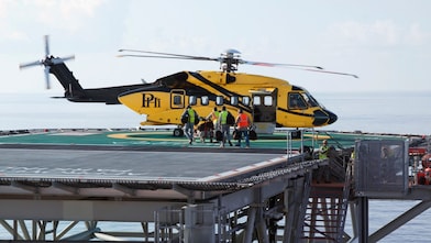Loading onto a helicopter on an oil platform
