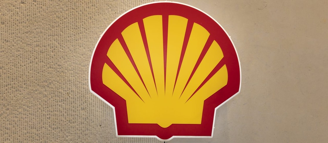 Shell logo displayed on a wall background.