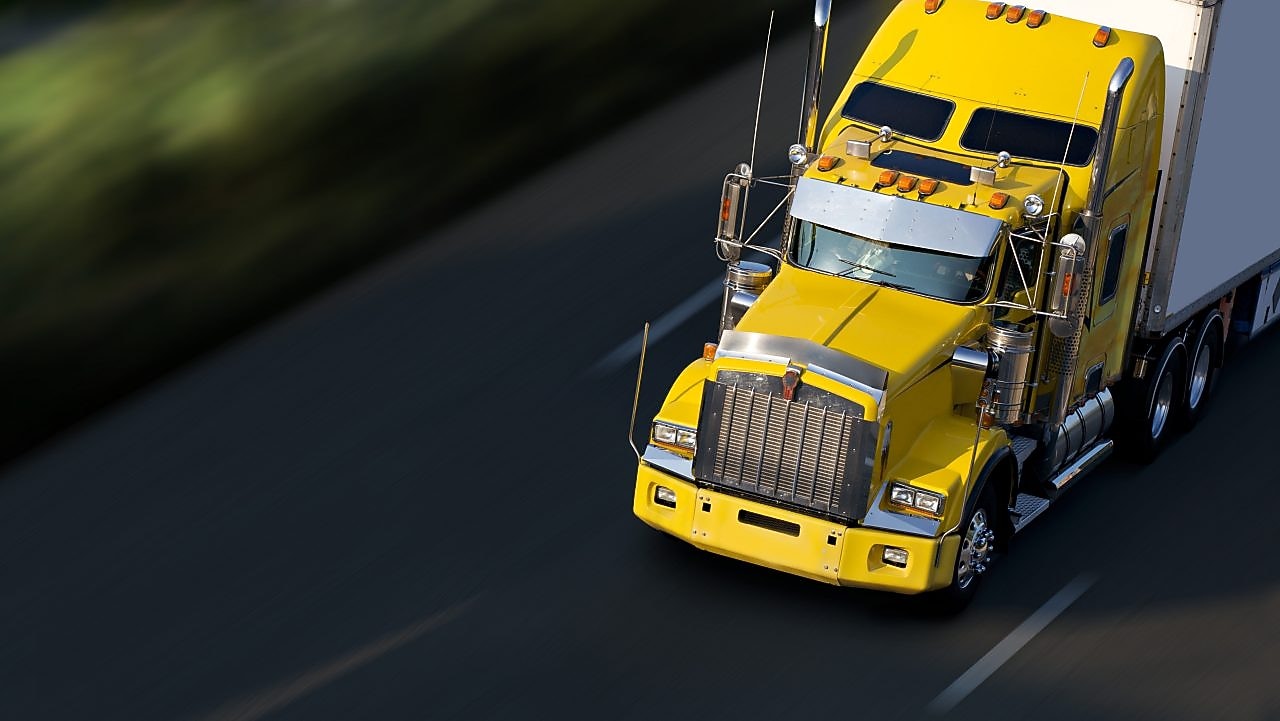truck driver driving on empty road