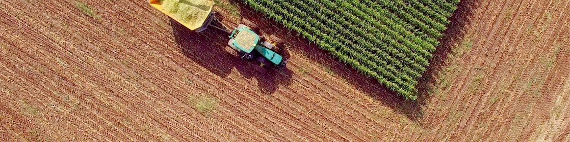 Aerial view of a tractor plowing farmland