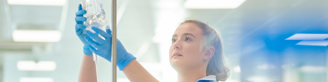 Healthcare worker with saline bag