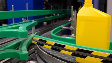 Plastic container on conveyer belt