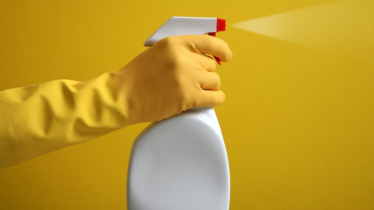 person holding spray