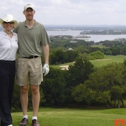 Kim with her husband on a golf course
