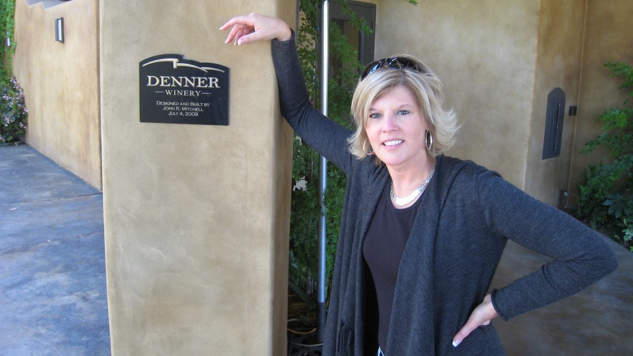 Kim standing in front of a winery