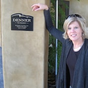 Kim standing in front of a winery