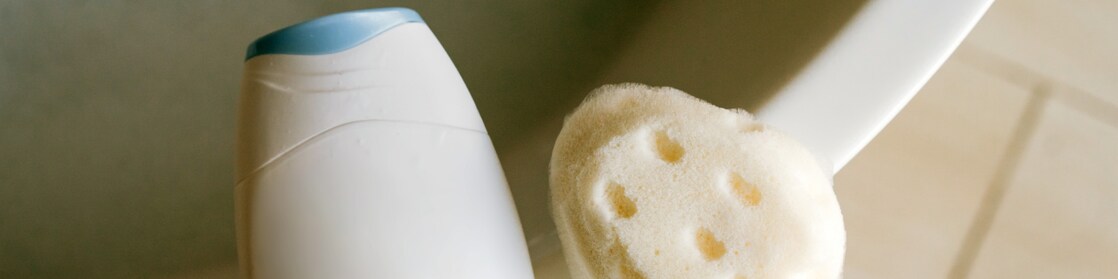 White plastic bottle and washcloth