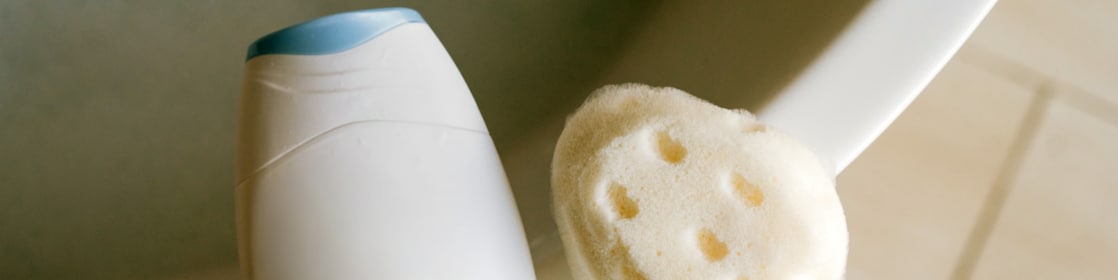 White plastic bottle and washcloth