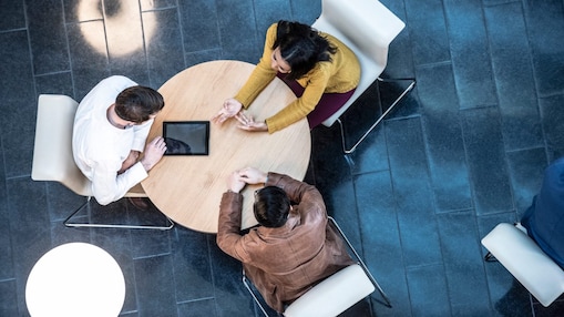 Team of Polymer Experts talking around a table