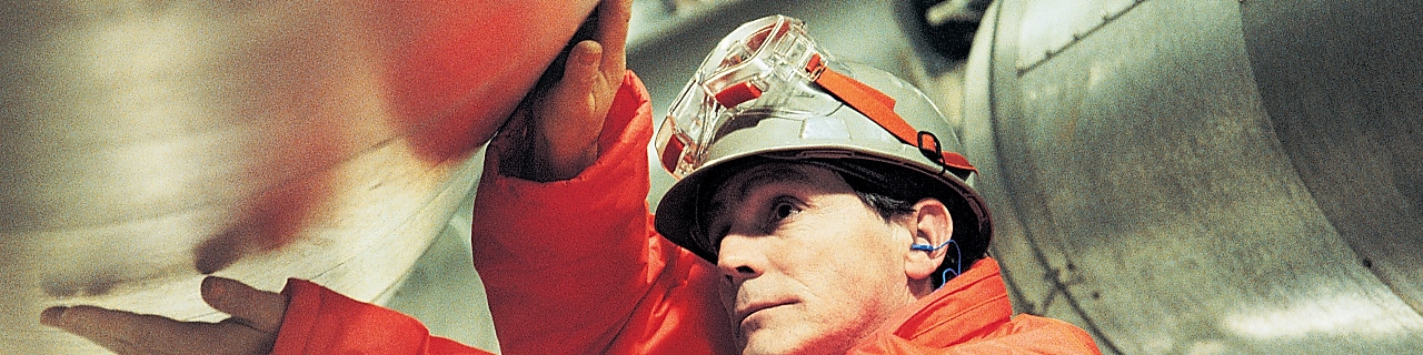 polyethylene plant worker inspects plant operations