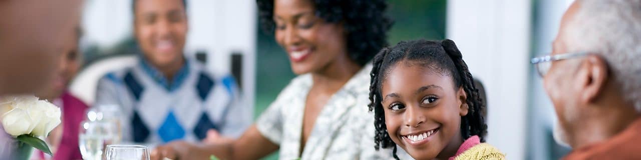 Family of a multigenerational home eating dinner together