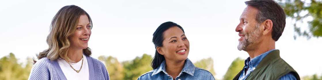 Group of three people having conversation