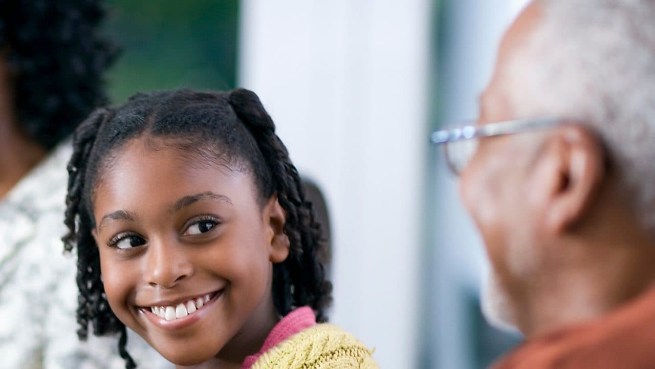 Family of a multigenerational home eating dinner together