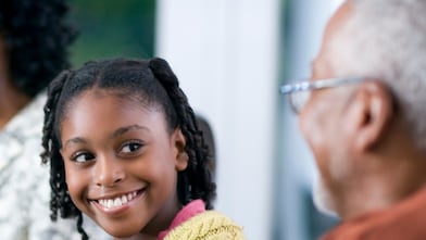 Family of a multigenerational home eating dinner together