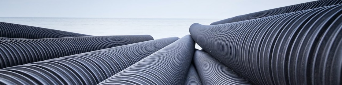 Black, corrugated HDPE plastic pipe that pipe extruders would make