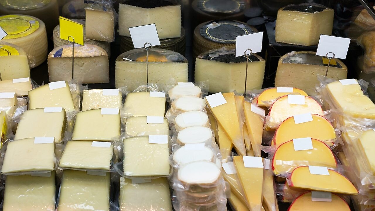 A shelf of bulk cheese using lldpe plastic film wrap