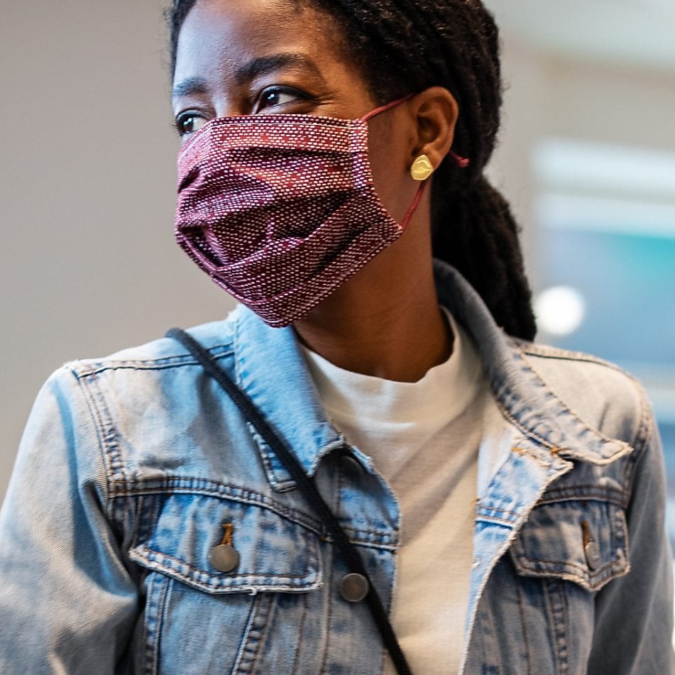 Woman wearing mask at supermarket