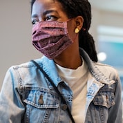 Woman wearing mask at supermarket