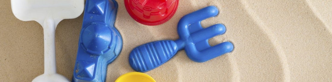 Plastic toys in sandbox