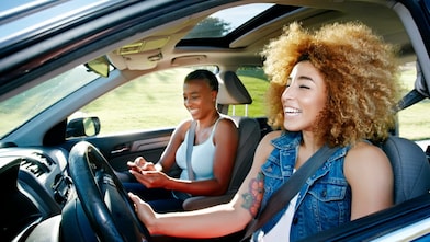 Daughter driving mother in car