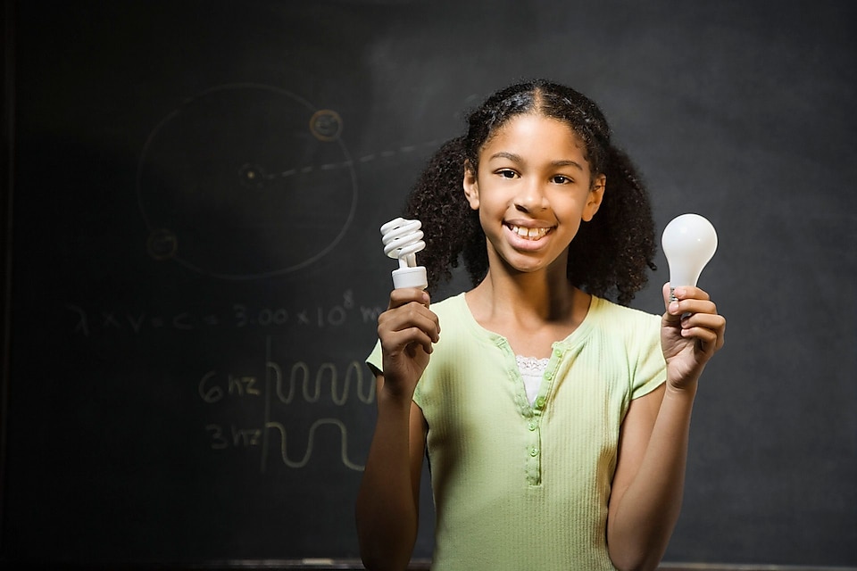 Girl holding light bulbs