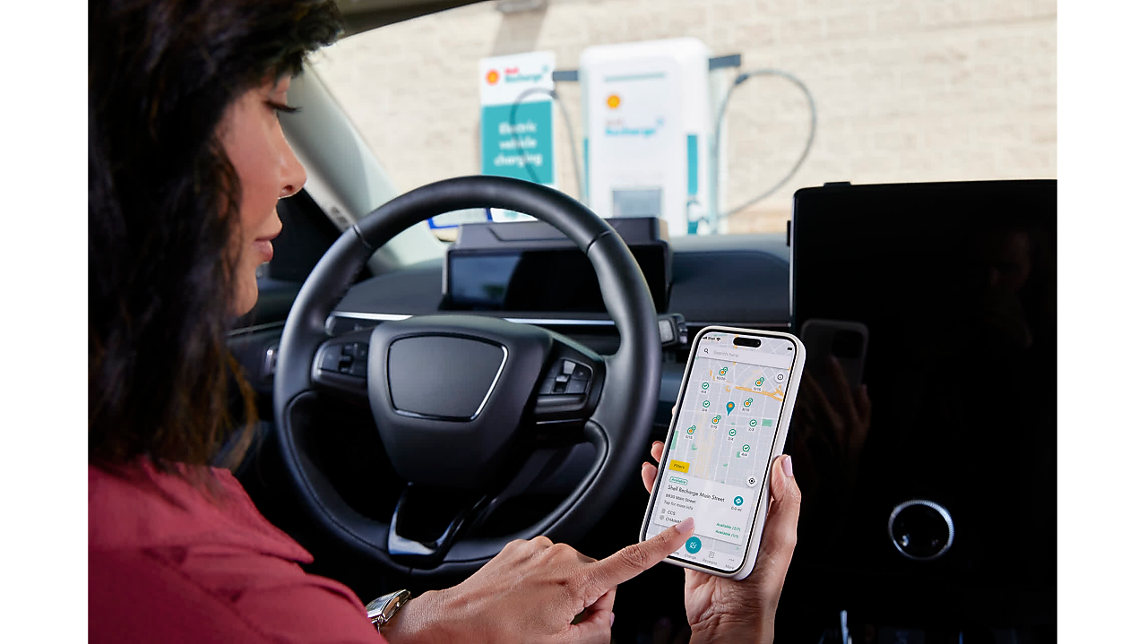 Women checking her vehicle charging status