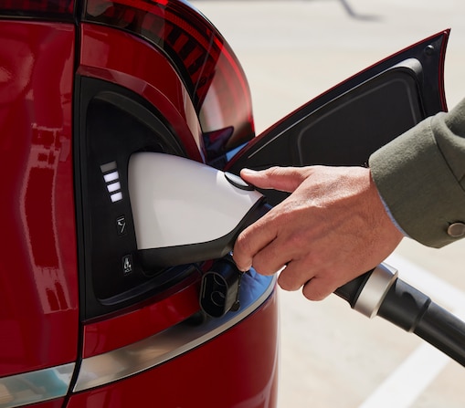 red ev in a charger
