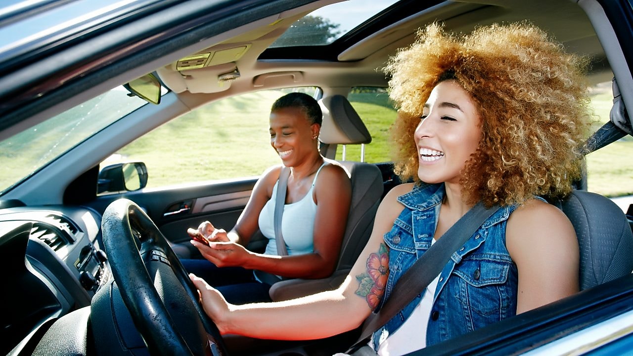 Daughter driving mother in car