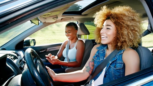 Daughter driving mother in car