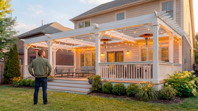 exterior shot of a man looking at his house back porch