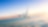Commercial airplane flying above clouds in dramatic sunset light