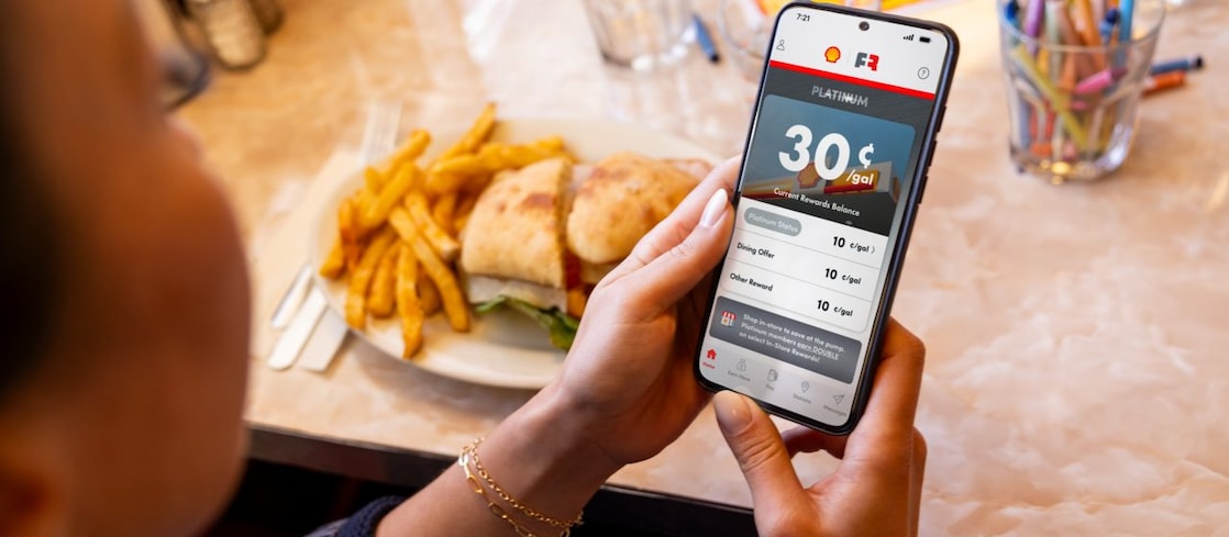 woman and man in restaurant looking at a menu