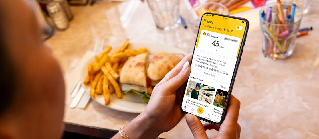woman and man in restaurant looking at a menu