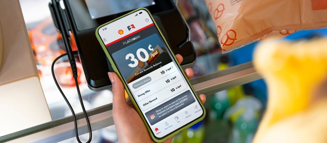 woman looking at FR account while in store