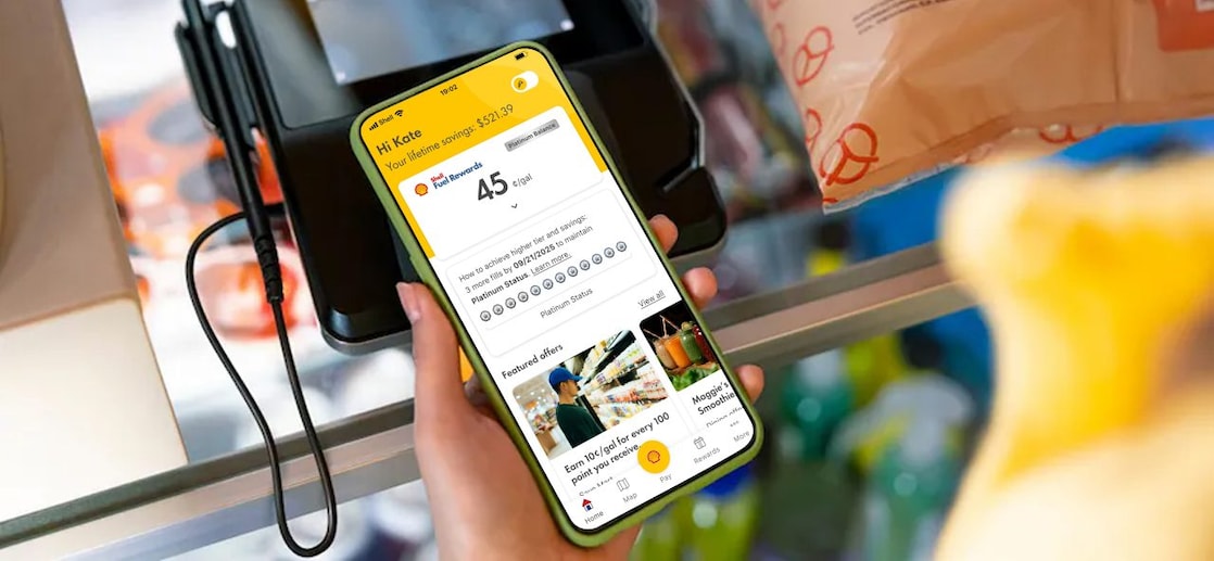 woman looking at FR account while in store