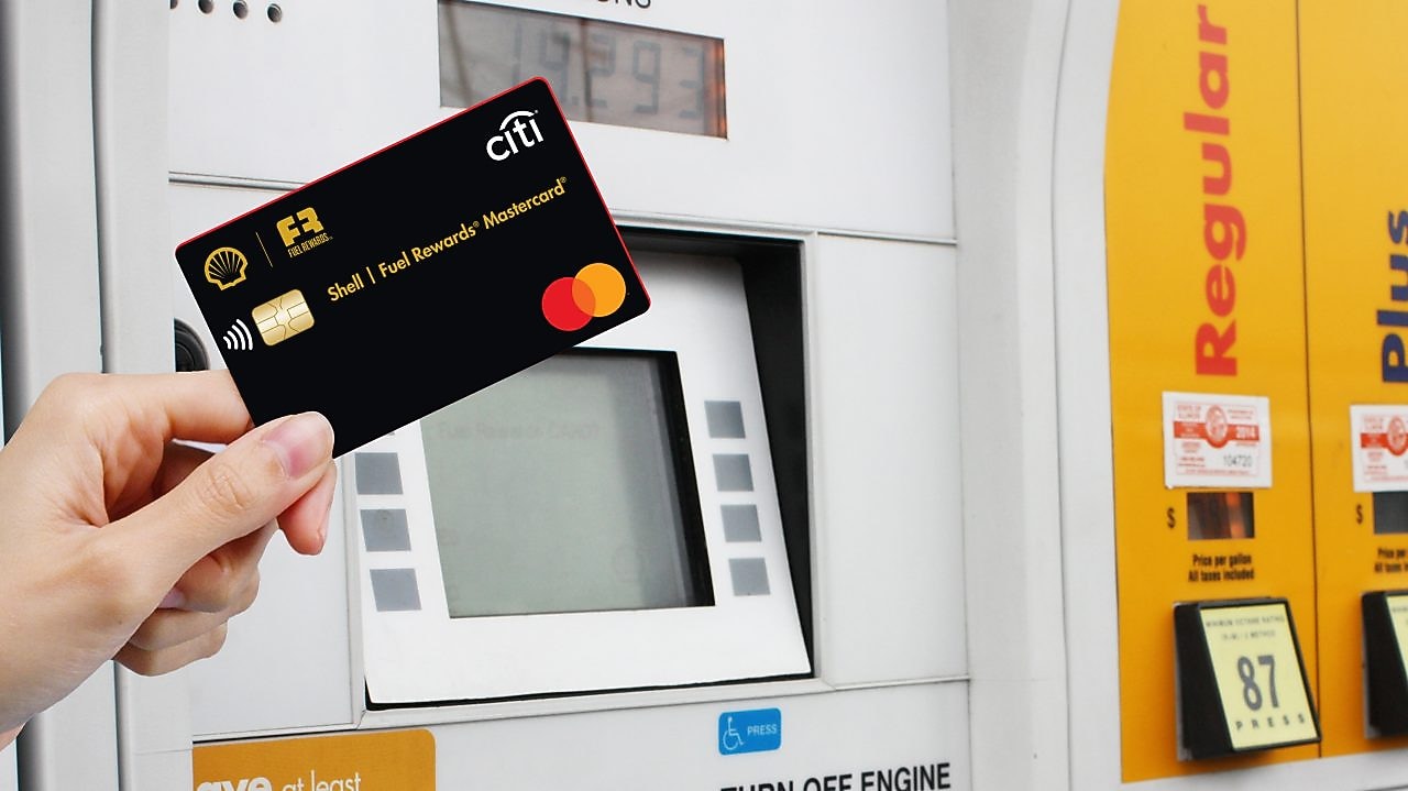 Hand holding Shell fuel rewards mastercard