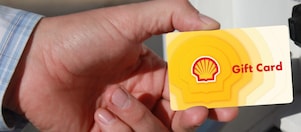 Person inserting Shell Gift Card into reader