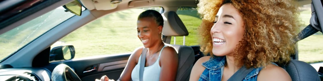 Daughter driving mother in car