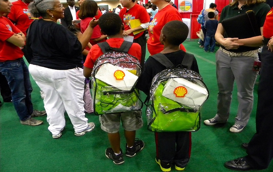 Young students wearing Shell backpacks