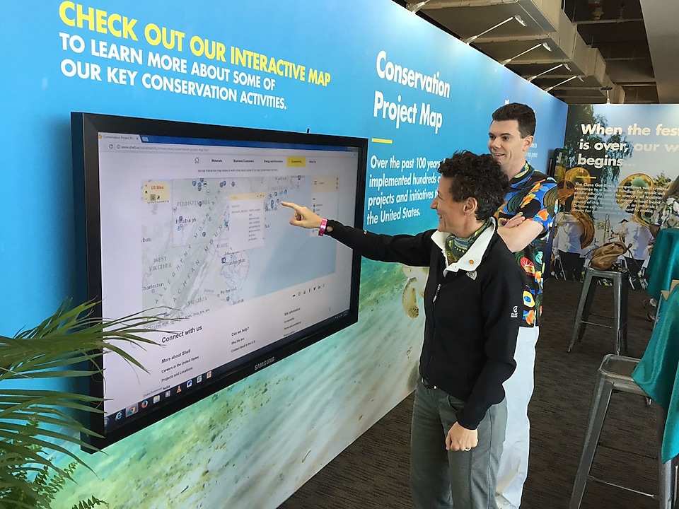 Esme Fantozzi, General Manager of GoM Fit For the Future Delivery, interacting the Conservation Project Map at JazzFest
